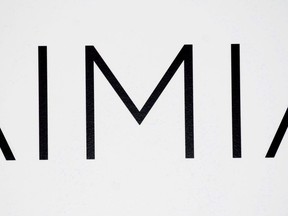 An AIMIA logo is shown at the company's annual general meeting in Montreal, Friday, May 4, 2012. Aimia Inc. has signed a deal to raise up to $32.5 million in a private placement of shares and warrants that will be used to fund operations and support its strategic investment plans.