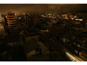 Tha dark neighbourhoods in northern Quito, during a national blackout on January 15, 2009. Photographer: Pablo Cozzaglio/AFP/Getty Images