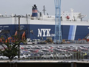 FILE - Cars for export park at a port in Yokohama, near Tokyo, on July 6, 2020. Japan's exports climbed 4.3% in September from a year earlier as shipments of vehicles, machinery and electronics rose while imports of oil and gas fell sharply, the government said Thursday, Oct. 19, 2023.