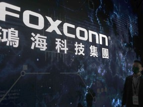 FILE - The Foxconn logo is seen during the Hon Hai Tech Day at the Nangang Exhibition Center in Taipei, Taiwan, on Oct. 18, 2022. Foxconn, a Fortune 500 company known globally for making Apple iPhones, was recently subjected to searches by Chinese tax authorities, state media reported Sunday, Oct. 22, 2023.
