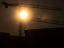 The sun sets behind construction cranes in Toronto.  The number of dedicated rental units under construction in the GTA fell to 18,267 in the third quarter.