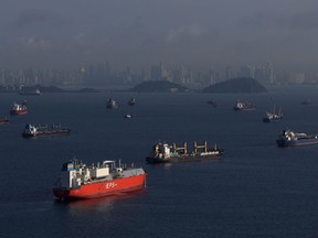 Ships wait in the Panama Bay near the Panama Canal.
