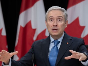 Federal Industry Minister François-Philippe Champagne says the foreign workers that NextStar Energy Inc. plans to bring in to help build a battery plant in Windsor, Ont. will help set up the industry for decades of success. Champagne gestures to a reporter as he responds to a question during a news conference, Tuesday, October 24, 2023 in Ottawa.