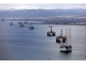 Mobile offshore drilling units stand in the Port of Cromarty Firth in Cromarty, U.K., on Wednesday, March 22, 2017. Even as oil production declined in the North Sea over the last 15 years, economic activity has been buoyed by offshore windmills.