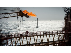 A gas flare burns from a pipe aboard an offshore oil platform in the Persian Gulf's Salman Oil Field, operated by the National Iranian Offshore Oil Co., near Lavan island, Iran, on Thursday, Jan. 5. 2017. Nov. 5 is the day when sweeping U.S. sanctions on Iran's energy and banking sectors go back into effect after Trump's decision in May to walk away from the six-nation deal with Iran that suspended them. Photographer: Ali Mohammadi/Bloomberg