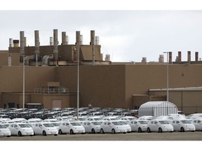 Vehicles packaged for shipment sit outside the General Motors Co. Orion Assembly plant in Orion Township, Michigan, U.S., on Friday, March 22, 2019. General Motors Co. committed to investing $1.8 billion at plants in six states and to creating 700 new jobs, as the largest U.S. automaker looks to ward off months of criticism by President Donald Trump.