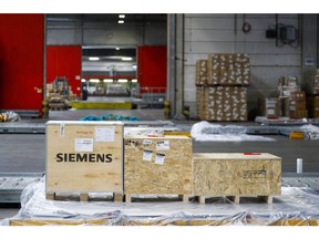 A Siemens AG branded shipping box stands on a caster deck at the airfreight depot, operated by Frankfurt Cargo Services GmbH, at Frankfurt Airport in Frankfurt, Germany, on Thursday, June 4, 2020. The global health crisis has led the halt of fleets worldwide while at the same time driving demand for air freight capacity to transport emergency medical supplies like masks and other protective medical gear made in countries like China. Photographer: Alex Kraus/Bloomberg