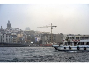 A construction crane viewed from the Bosphorus in Istanbul, Turkey, on Monday, Nov. 8, 2021. Prices in one of the world's hottest property markets are poised to rise further after banks start slashing mortgage costs following last week's interest rate cut, and citizens seek refuge against rampant inflation.