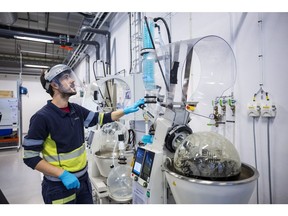 A worker operates a crystallizer machine at the Northvolt Labs R&D center in Västerås, Sweden.