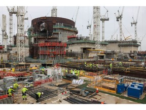 Contractors work near the Unit 1 nuclear reactor at Hinkley Point C nuclear power station construction site in Bridgwater, UK, on Wednesday, July 20, 2022.  Photographer: Hollie Adams/Bloomberg