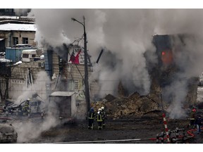 Emergency services attend the site of a Russian missile attack in Kyiv in 2022.