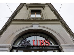 Signage outside a UBS Group AG bank branch in Bern, Switzerland, on Monday, Jan. 30, 2023. UBS are scheduled to report on their latest earnings on Tuesday.