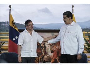 Gustavo Petro, Colombia's president, left, and Nicolas Maduro, Venezuela's president, meet at the Tienditas International Bridge in Cucuta, Colombia, on Thursday, Feb. 16, 2023. During the meeting near the border, the heads of state signed a memorandum of understanding focused on modernizing trade rules between Colombia and Venezuela. Photographer: Ferley Ospina/Bloomberg