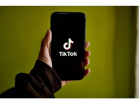 The TikTok logo on a smartphone arranged in the Brooklyn borough of New York, US, on Thursday, March 9, 2023. The US is moving closer to restricting access to the popular video-sharing app TikTok, with Senate Intelligence Committee Chairman Mark Warner set to unveil a bill Tuesday that the Biden administration is poised to support, according to people familiar with the issue. Photographer: Gabby Jones/Bloomberg