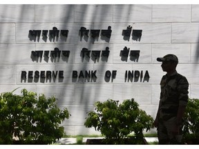 Signage of the Reserve Bank of India (RBI) at its head office in Mumbai, India, on Thursday, April 6, 2023. The Reserve Bank of India's six-member Monetary Policy Committee unanimously voted on Thursday to keep the repurchase rate at 6.50%, a move expected by only six of 33 economists surveyed by Bloomberg.