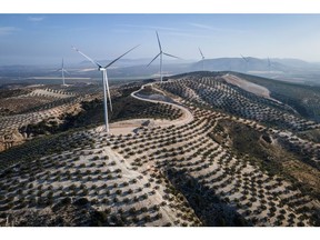 Wind turbines along the crest of a hill at the Martin de la Jara wind farm, operated by Iberdrola SA, in the Martin de la Jara district of Sevilla, Spain, on Friday, April 21, 2023. In November, Spain's biggest utility Iberdrola said it would allocate €27 billion over the next three years to power grids, expanding and strengthening capacity as more renewable energy flows into the system and industries electrify.