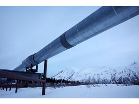 DELTA JUNCTION, ALASKA - MAY 05: A part of the Trans Alaska Pipeline System runs past Alaska Range mountains on May 5, 2023 near Delta Junction, Alaska. The 800-mile-long pipeline carries oil from the North Slope in Prudhoe Bay to the port of Valdez. In March, the Biden administration approved the controversial Willow project which will extract 600 million barrels of oil from the National Petroleum Reserve on Alaska's North Slope, close to the Arctic Ocean.