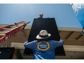 Workers install solar panels during a SunPower installation on a home in Napa, California, US, on Monday, July 17, 2023. SunPower Corp. is scheduled to release earnings figures on August 1.