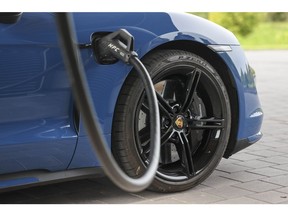 A Porsche Taycan electric vehicle fast charges. Photographer: Alex Kraus/Bloomberg