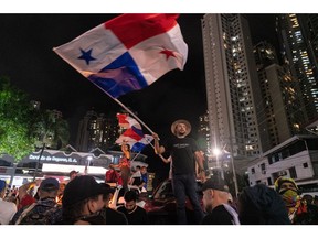 Demonstrators wave Panamanian flags during a protest against First Quantum Minerals Ltd. in Panama City, Panama, on Wednesday, Oct. 25, 2023. Labor unions, environmentalists and students paralyzed swathes of Panama on Wednesday as mass protests against FQM's giant copper mine show no sign of abating.