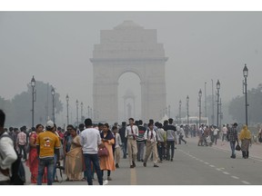 Visitors at the India Gate amid heavy smog in New Delhi, India, on Nov. 4.