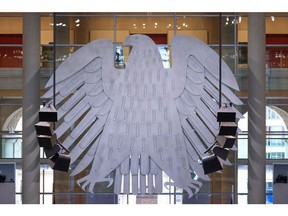 The Bundestag Federal Eagle symbol, ahead of an address by Olaf Scholz, Germany's chancellor, on the Federal Constitutional Court's ruling on the €60 billion ($65.2 billion) climate fund, at the Bundestag in Berlin, Germany, on Tuesday, Nov. 28, 2023. Scholz promised that his government will forge ahead with investments needed to modernize the economy and maintain international competitiveness even after this month's court ruling upended its budget planning.