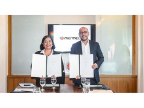 Anneli Lontoc, the Undersecretary of the Department of Transportation and Communications of the Philippines, left and Angelo Petrosillo, Vice President for International Affairs at Mermec.