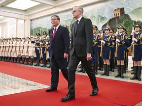 Australian Prime Minister Anthony Albanese, right, walks with Chinese Premier Li Qiang during a ceremonial welcome at the Great Hall of the People in Beijing, China, Tuesday, Nov. 7, 2023. Albanese is on the final day of a three-day visit to China.
