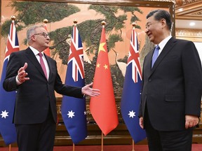 Australia's Prime Minister Anthony Albanese, left, gestures as he meets with China's President Xi Jinping at the Great Hall of the People in Beijing, China, Monday, Nov. 6, 2023. Albanese is on a three-day visit to China.