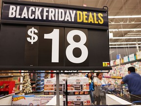People shop ahead of Black Friday at Walmart in Burbank, California. Some early Black Friday deals are already in place at Walmart and other retailers ahead of Thanksgiving and the traditional holiday shopping season.