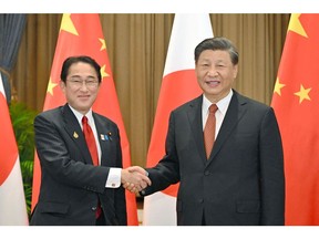 Fumio Kishida, left, with Xi Jinping during their meeting in Bangkok in November 2022. Source: JIJI Press/AFP/Getty Images