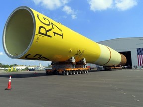 FILE - A huge foundation for an Orsted offshore wind turbine, called a monopile, sits atop wheeled movers in Paulsboro, N.J., July 6, 2023. The Danish wind energy developer Ørsted said it's scrapping its Ocean Wind I and II projects off southern New Jersey due to problems with supply chains, higher interest rates and a failure to obtain desired tax credits.