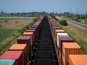 Cargo containers and cars carrying coal