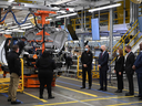 U.S. President Joe Biden stands on the GMC Hummer EV production line as he tours the General Motors Factory ZERO electric vehicle assembly plant in Detroit on Nov. 17, 2021.