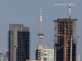 A construction crane atop a new building in Toronto.