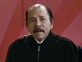 FILE - Nicaragua's President Daniel Ortega poses for a photo during the ALBA Summit at the Palace of the Revolution in Havana, Cuba, Tuesday, Dec. 14, 2021. A new study released Wednesday, Nov. 29, 2023 says that about half of Nicaragua's population of 6.2 million want to leave their homeland because of a mix of economic decline and repression from President Daniel Ortega's government. The study said that 23% considered themselves "very prepared" to emigrate.