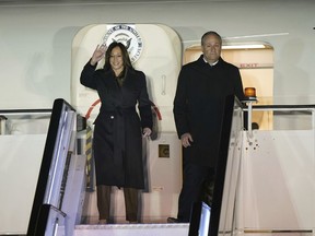 US Vice President Kamala Harris, with husband Second Gentleman Douglas Emhoff, arrives at Stansted Airport for her visit to the UK to attend the AI safety summit at Bletchley Park, in Stanstead, England, Tuesday, Oct. 31, 2023.