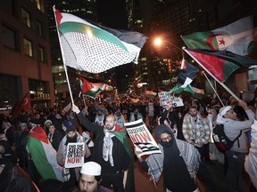 People attend a march for Gaza rally in support of Palestine in Toronto on Nov. 4.