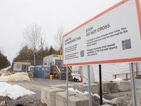 A sign advising people that entrance to Canada via Roxham Road is illegal on the Canada/U.S. border in Hemmingford, Que.