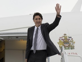 Prime Minister Justin Trudeau as he boards a government plane in Ottawa.