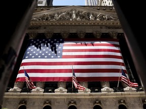 The American flag is shown at the New York Stock Exchange on Wednesday, June 29, 2022 in New York. Stocks shifted between gains and losses on Wall Street Wednesday, keeping the market on track for its fourth monthly loss this year.