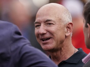 FILE - Amazon founder Jeff Bezos is seen on the sidelines before the start of an NFL football game between the Kansas City Chiefs and the Los Angeles Chargers Thursday, Sept. 15, 2022, in Kansas City, Mo. Bezos' fund to support homeless families announced $117 million in new grants on Tuesday, Nov. 21, 2023 to organizations across the U.S. and Puerto Rico. The grants are a part of a $2 billion commitment Bezos made in 2018 to support homeless families and to run free preschools.