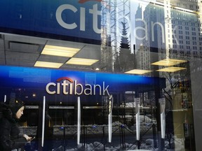 FILE - In this March 16, 2017, file photo, a customer enters a Citibank branch, in New York. Citigroup intentionally discriminated against Armenian Americans when they applied for credit cards, the Consumer Financial Protection Bureau said Wednesday, Nov. 8, 2023.