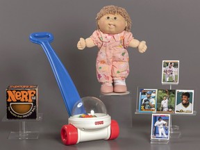 This photo provided by the National Toy Hall of Fame shows their 2023 inductees. From left, NERF, Fisher-Price Corn Popper, Cabbage Patch Kids, and baseball cards. They will be permanently installed at the Toy Hall of Fame in Rochester, NY. (National Toy Hall of Fame via AP)