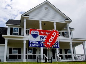 A sold sign stands outside a house in North Carolina. Real estate brokerage agencies have been found liable for US$1.8 billion in damages in a lawsuit over commissions.