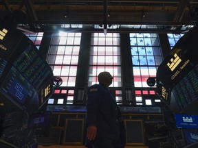 A trader works on the floor of the New York Stock Exchange.