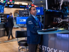 Traders work on the floor of the New York Stock Exchange.