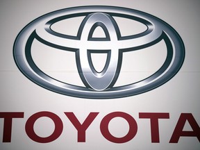 FILE - A logo of Toyota Motor Corp. at a dealer Wednesday, May 11, 2022, in Tokyo. Toyota is selling a part of its stake in components maker Denso to raise cash for its drive toward electric vehicles and other innovations, Japan's top automaker said Wednesday, Nov. 29, 2023.