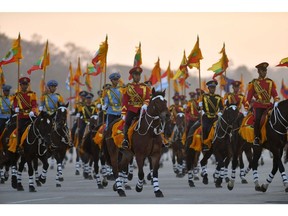 Soldiers on horseback lead the convoy of Myanmar military chief Min Aung Hlaing as he arrives at the parade ground to mark the country's Independence Day in Naypyidaw on January 4, 2023. Photographer: STR/AFP/Getty Images