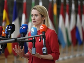Estonia's Prime Minister Kaja Kallas speaks with the media as she arrives for an EU summit at the European Council building in Brussels, Friday, Oct. 27, 2023. European Union leaders conclude a second day of meetings on Friday in which they will discuss, among other issues, migration.